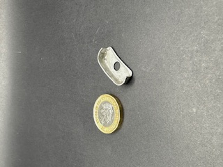 CNC machine spindle cutting metal workpiece with coolant spray