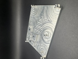 CNC machined aluminium part with precision pocketing pattern