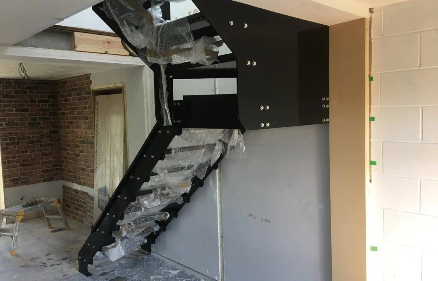Powder coated bespoke structural steel staircase fabricated in Milton Keynes