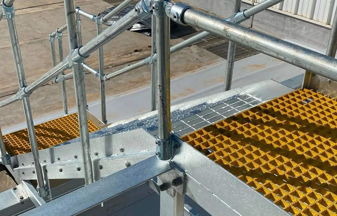 roof access platform bridging gap between two roofs
