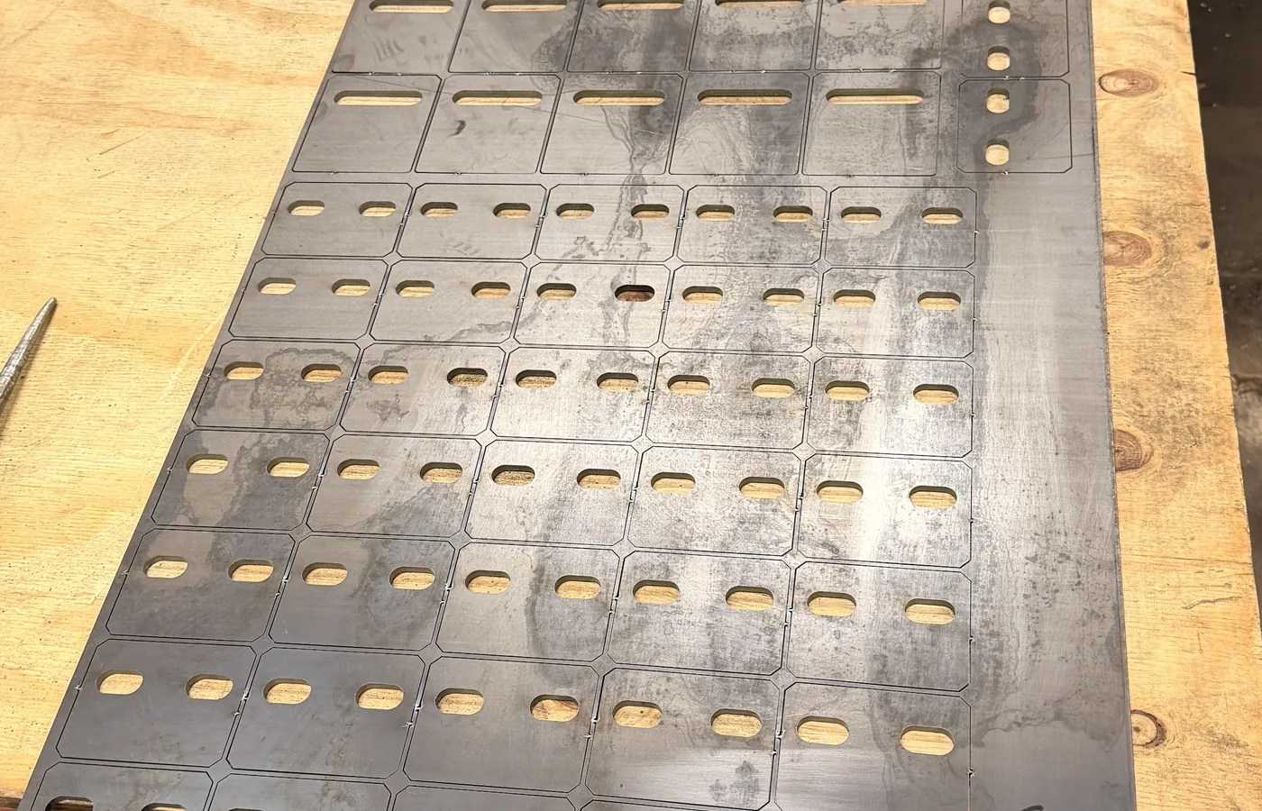 Production laser cutting nested sheet with repeated parts