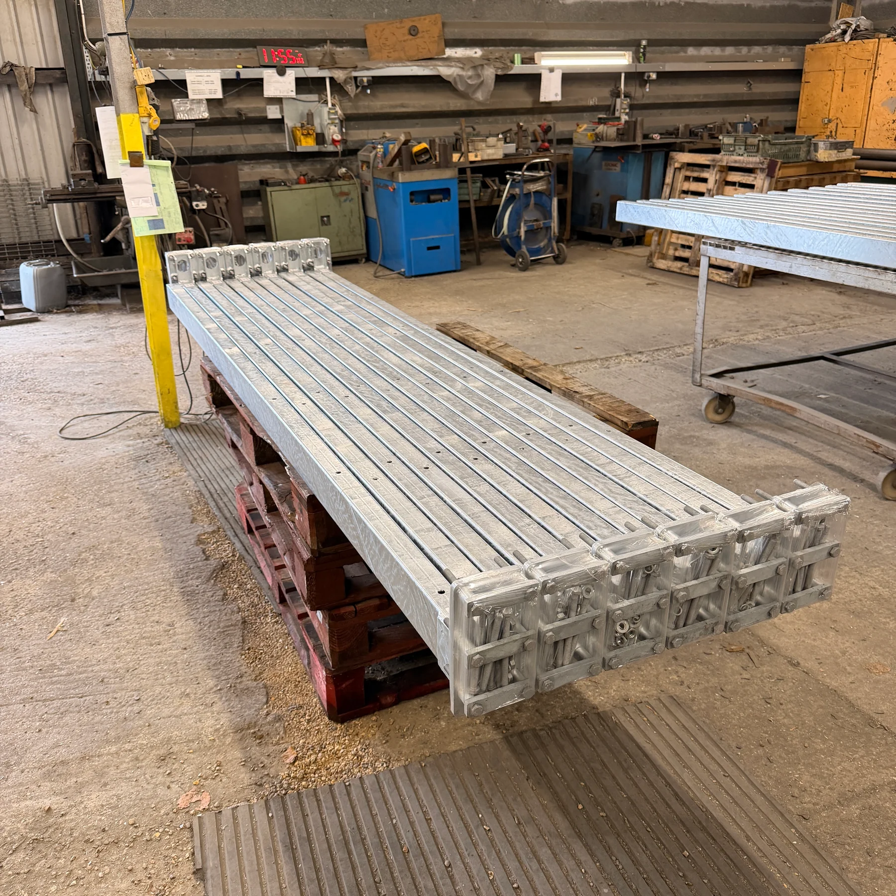 Long galvanised metal access panel assemblies manufactured at the Wards workshop